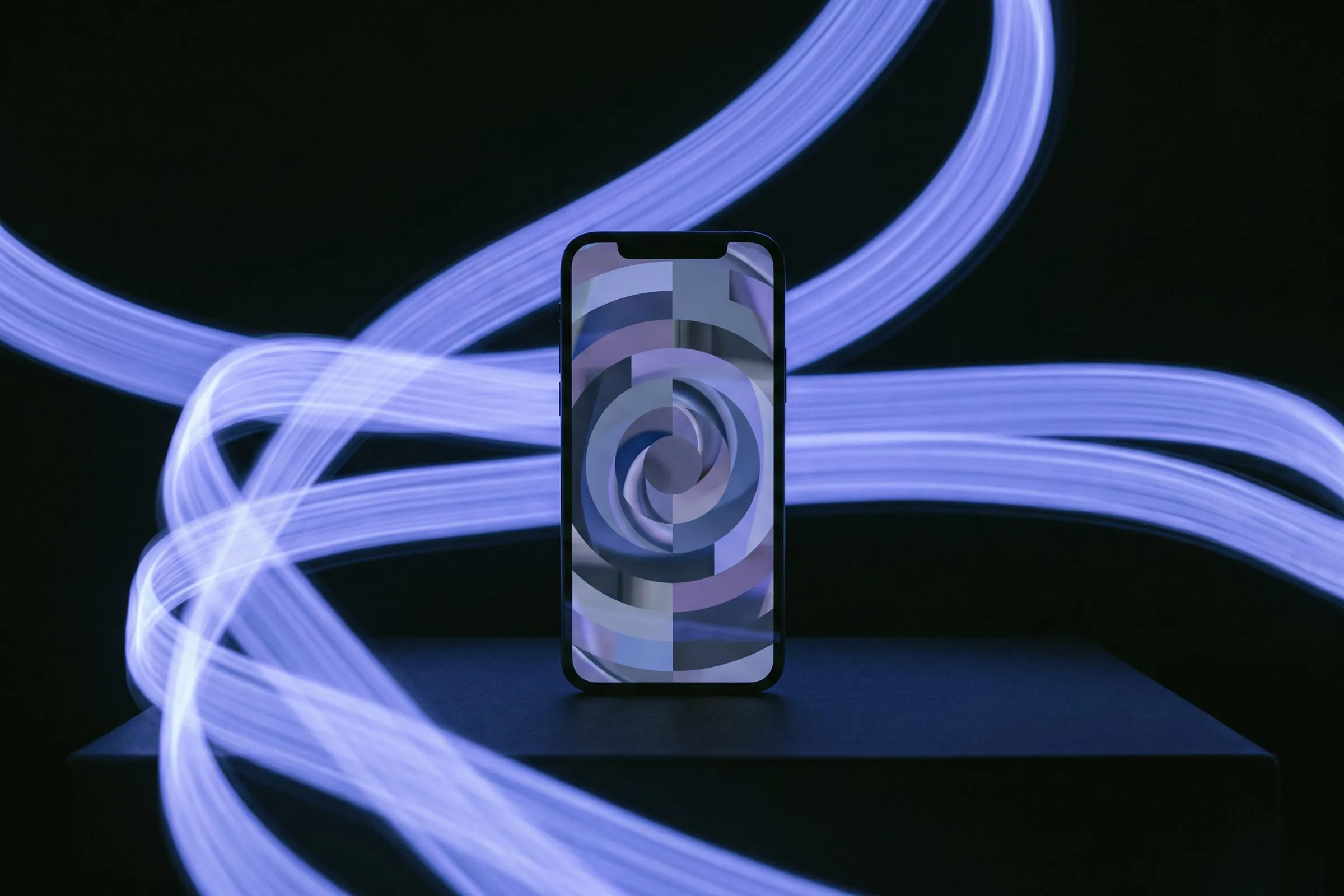 An upright phone showing a vertical video frame, surrounded by streaks of moving light.