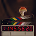 RYZE mushroom coffee logo with a stylized coffee cup topped with a glowing red mushroom.